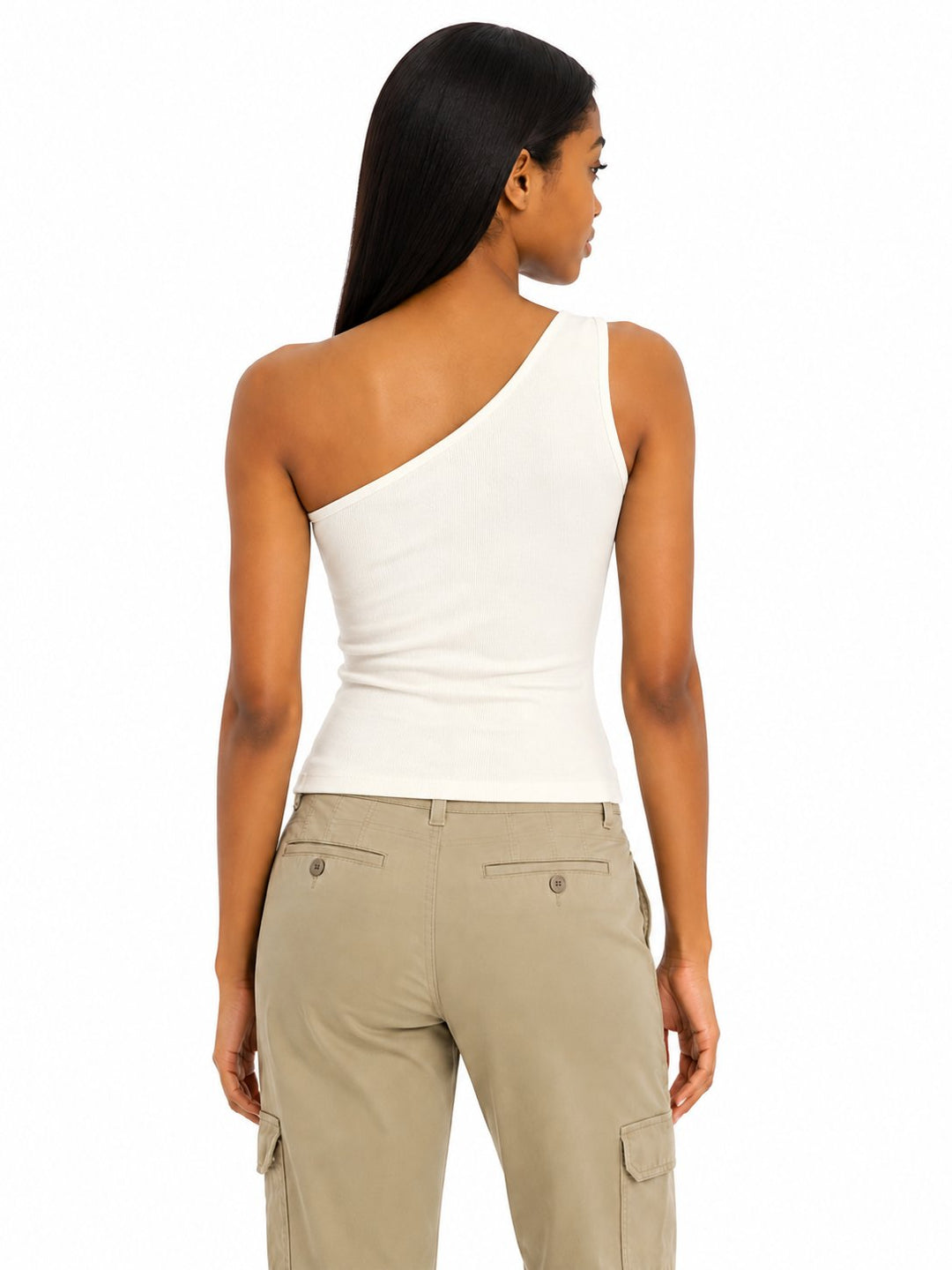 Woman wearing a white one-shoulder top and beige cargo pants on a white background