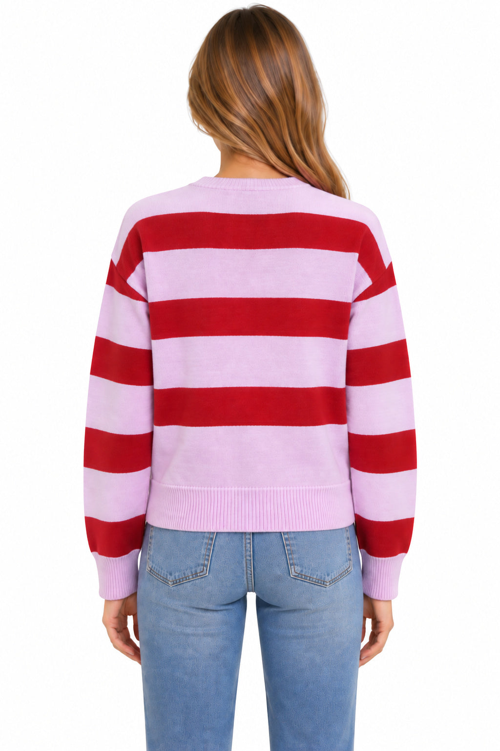 A woman viewed from the back wearing a light pink and red horizontally striped knit sweater with light blue jeans, set against a plain white background.